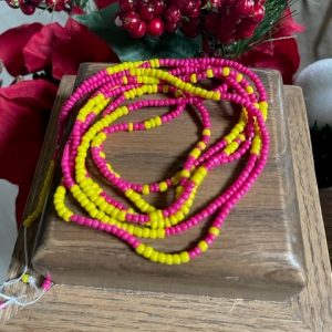 Pink and yellow coiled waist beads